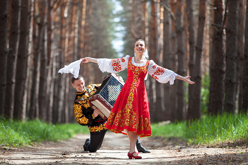 Couple in russian traditional dress on nature