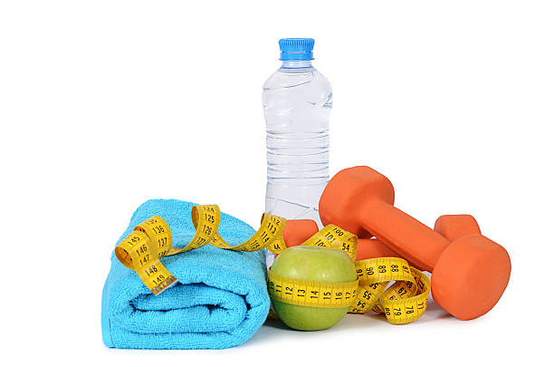 istock Measuring tape with dumbbells isolated 470325550