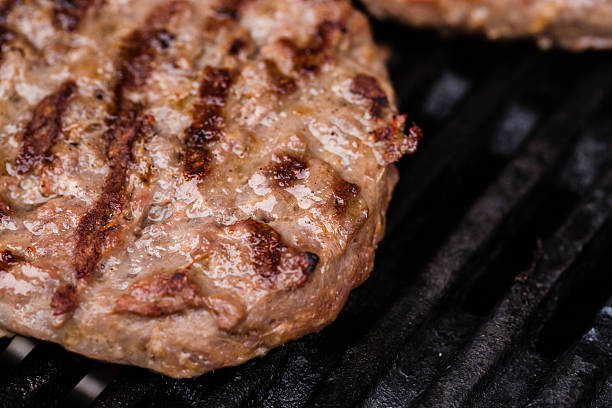 istock Preparing a batch of  grilled ground beef patties or frikadeller 470325976