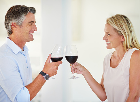 Shot of an affectionate couple toasting with red winehttp://195.154.178.81/DATA/i_collage/pi/shoots/795686.jpg