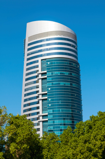SHARJAH, UAE - Decemeber 10, 2013: General view of modern building in Sharjah. Most industrialized emirate in UAE.