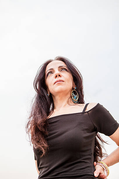 istock Beautiful Woman on Pier, Cloudy Sky 470328590