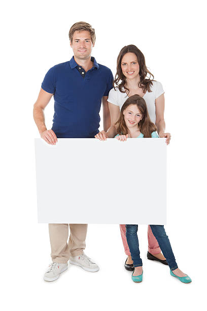 istock Confident Family Holding Blank Billboard 470329712