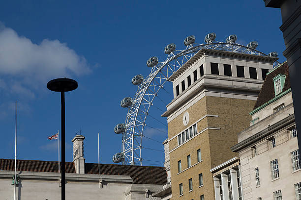 Dwarfed by London Eye stock photo