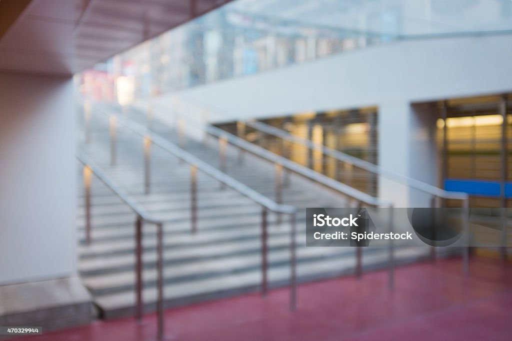 Out of focus Office Public Space with Stairs Background A blurry photograph of a set of stairs in a public office building 2015 Stock Photo