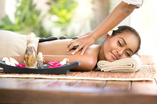 istock Beautiful woman getting spa hot stones massage 470330574