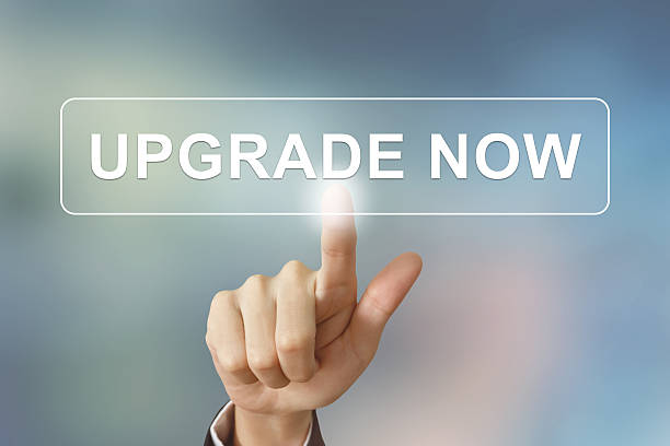 istock business hand clicking upgrade now button on blurred background 470332672
