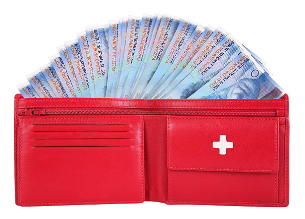 francos suizos en cartera rojo - swiss francs swiss currency switzerland finance fotografías e imágenes de stock