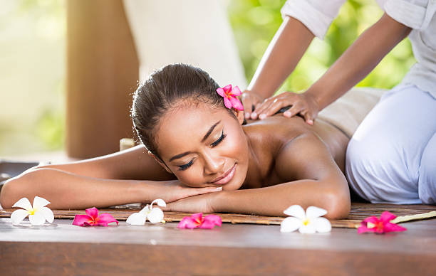 istock Smiling woman enjoying a massage 470332938