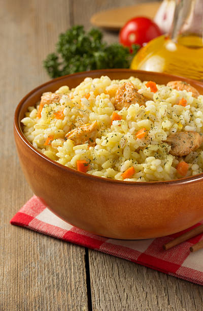 istock bowl full of rice on wood 470335054