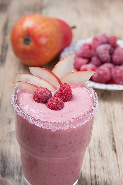 istock Fruit - berry smoothies with  pear and raspberries with yogurt . 470336910