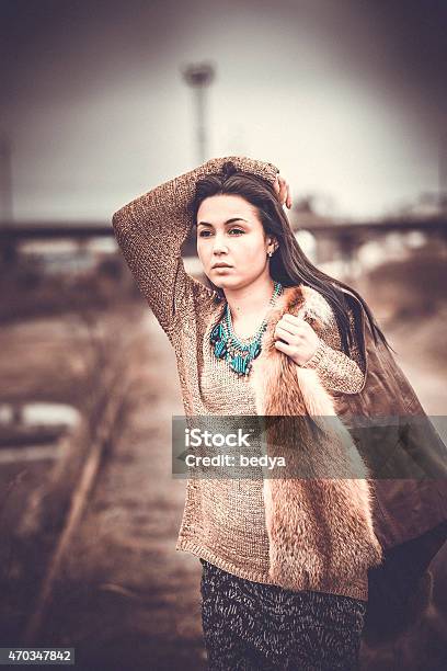 Long Hair Brunette Girl Outdoor With Old Industrial Bridge Behin Stock Photo - Download Image Now