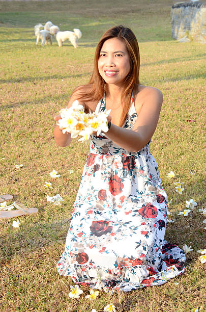 istock Woman flow white flowers 470349695