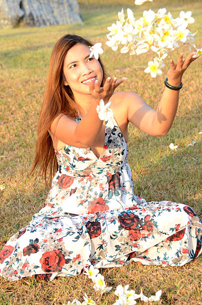istock Woman flow white flowers 470350489
