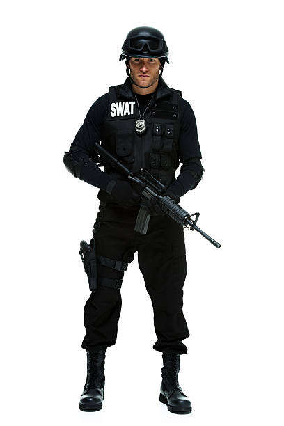 istock Front view of police standing with rifle 470357059
