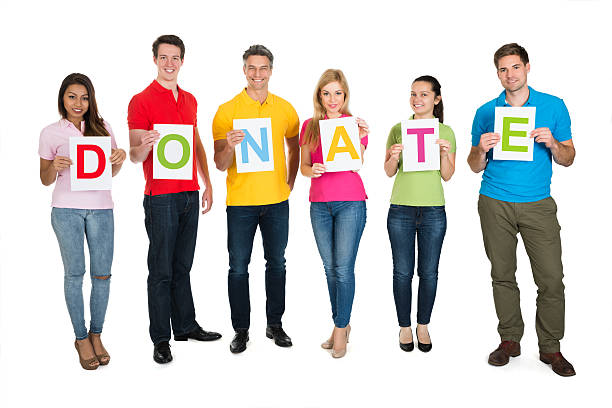 istock Group Of People Holding Letter Donate 470358474