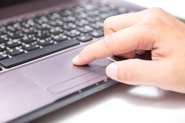 istock hands typing on a laptop trackpad 470359168