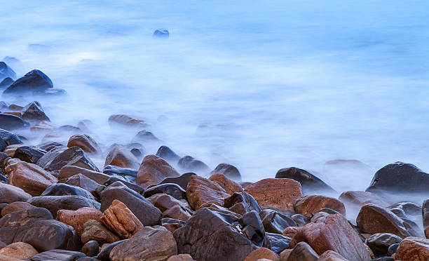 Long exposure of rocks and sea stock photo