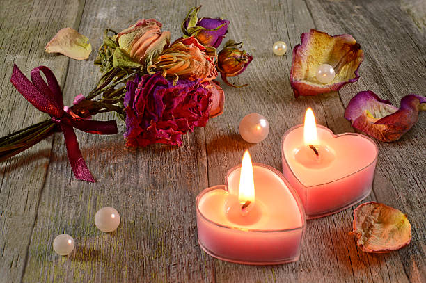 istock Two love candles with flowers 470361107