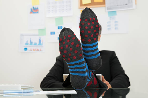 istock Businessman With Socks In His Feet 470363866
