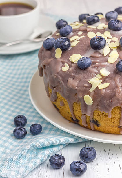 Homemade blueberry cake with icing and berry on top