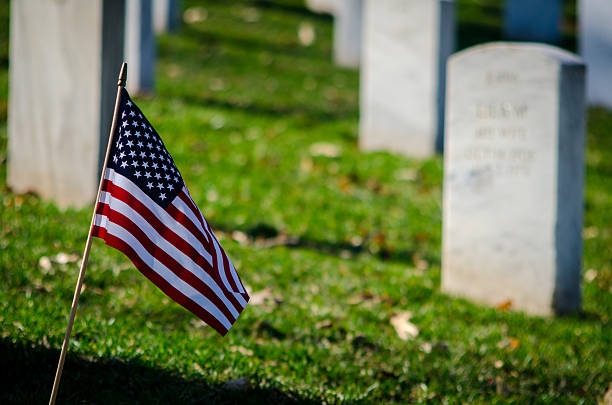 istock Amercan flag in a cemetery 470370268