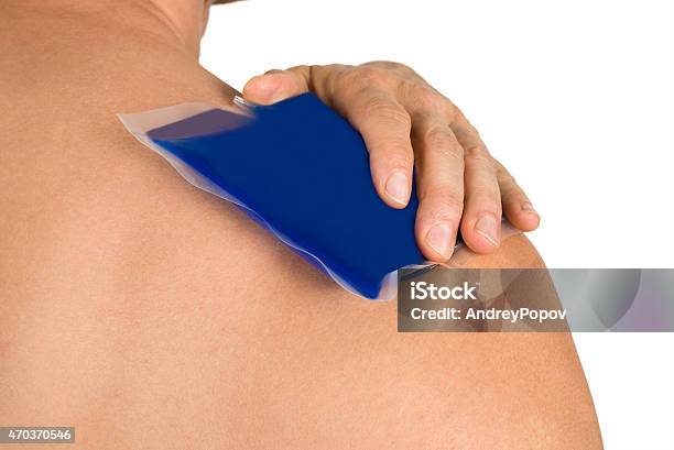 Hand With Cool Gel Pack On Shoulder Stock Photo - Download Image Now - Ice, Men, Shoulder