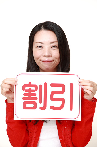 portrait of middle Japanese woman wearing a red cardigan on white background