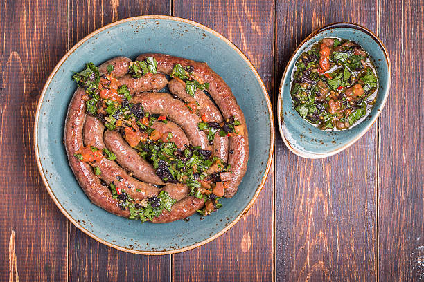 istock Grilled lamb sausage served with salsa 470403570
