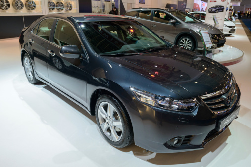Brussels, Belgium - January 14, 2014: Honda Accord Saloon Sedan family car on display at the 2014 Brussels motor show. People in the background are talking.