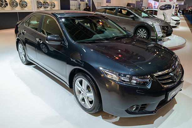 Honda Accord Saloon Brussels, Belgium - January 14, 2014: Honda Accord Saloon Sedan family car on display at the 2014 Brussels motor show. People in the background are talking. 2014 stock pictures, royalty-free photos & images