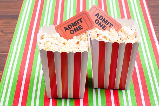 istock popcorn on movie tickets desk top view 470406132
