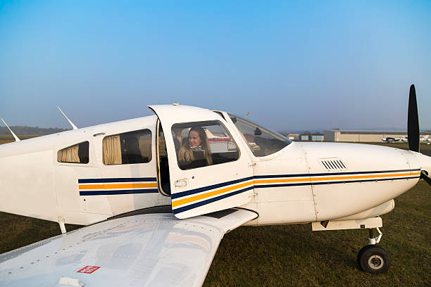 istock woman pilot in the aircraft 470406418