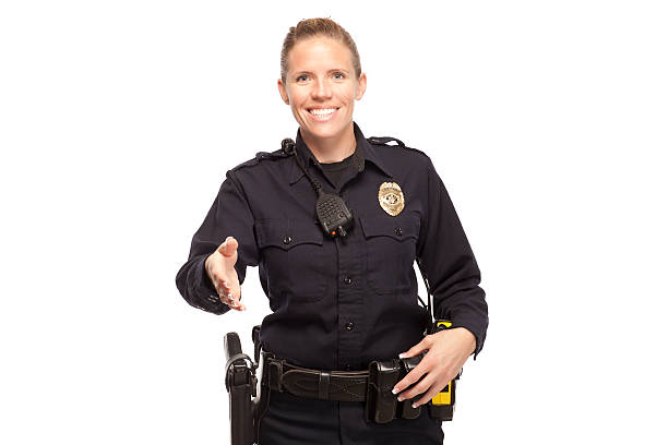 istock Female police officer offering handshake 470407026