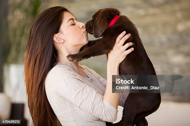 Give Me A Kiss Stock Photo - Download Image Now - Picking Up, Puppy, Adult