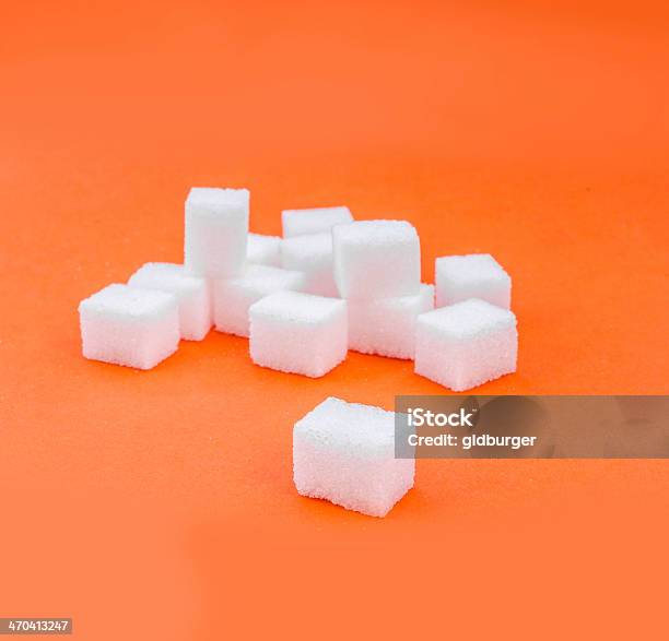 Foto de Pedra De Açúcar Em Fundo Laranja e mais fotos de stock de Pedra de açúcar - Pedra de açúcar, Açúcar, Comida