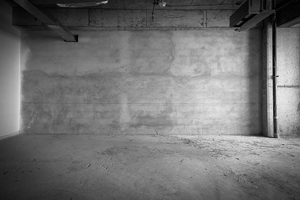 Empty building interior with concrete floors and walls stock photo
