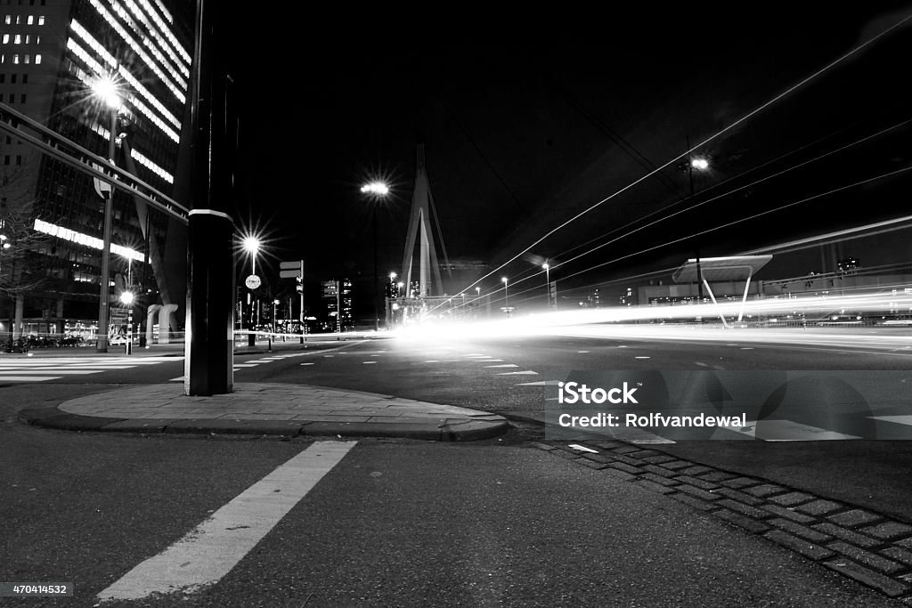 Erasmus bridge by night The erasmus bridge and a busy street at night. 2015 Stock Photo