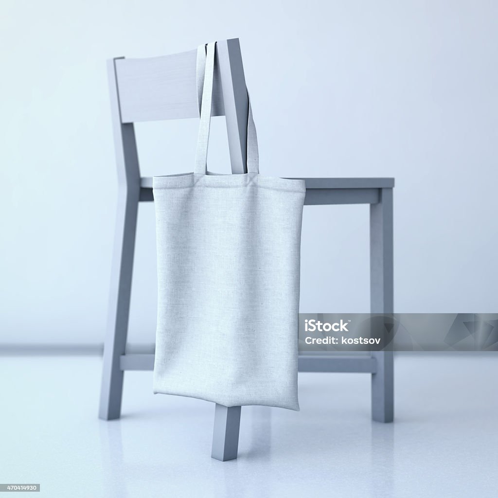 White cotton bag hanging on a chair. 3d rendering White cotton bag hanging on the back of a chair. 3d rendering 2015 Stock Photo