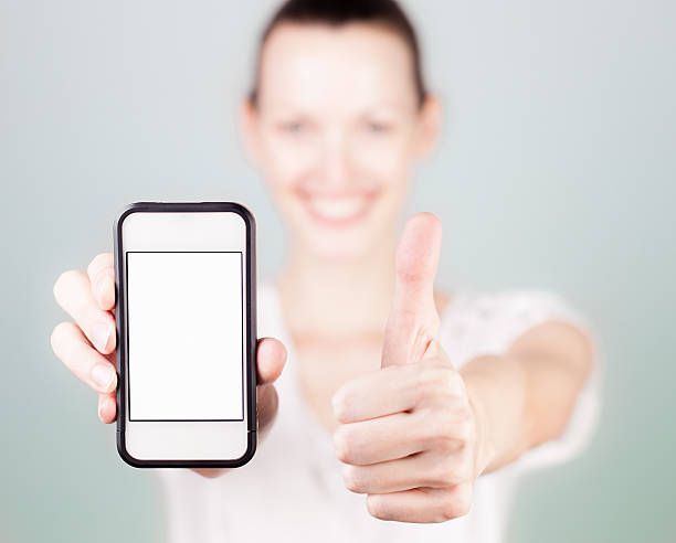 istock Woman thumbs up for smartphone 470415889