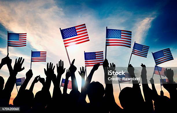 Group Of People Waving American Flags In Back Lit Stock Photo - Download Image Now - USA, Patriotism, Fourth of July