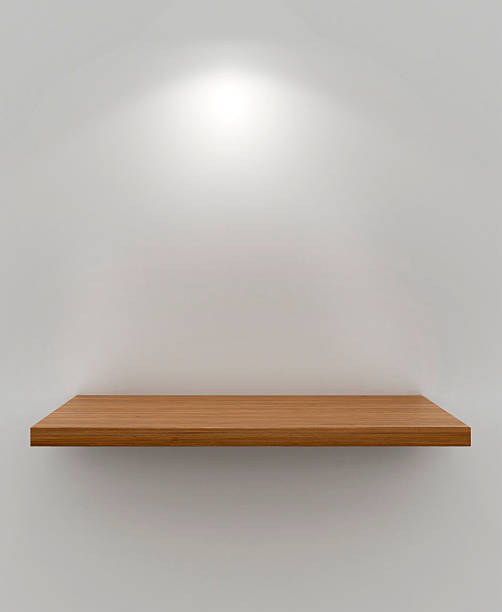 istock Isolated empty wooden floating shelf on white wall 470420785