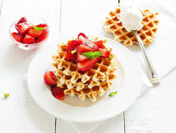 istock Homemade waffles with strawberry salad. 470423136