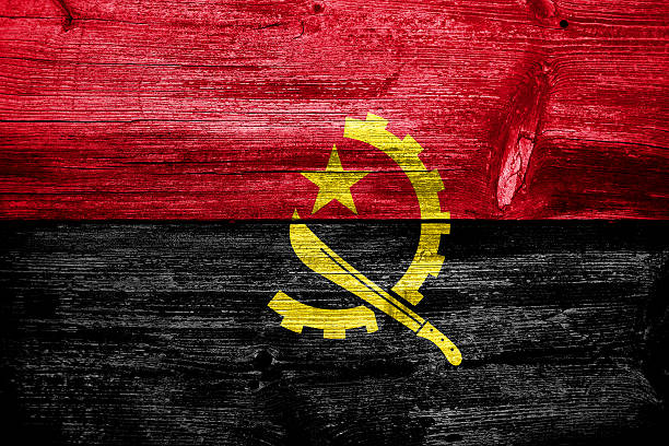 istock Angola Flag painted on old wood plank texture 470425687