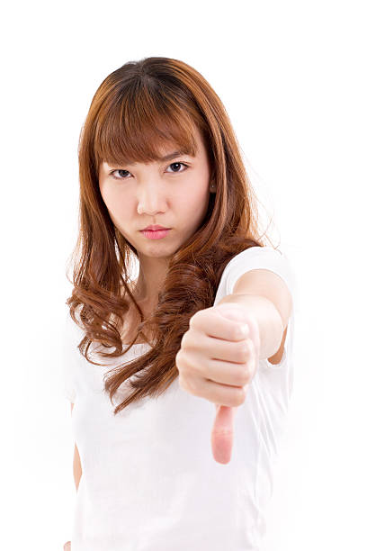 istock angry woman giving thumb down 470425958