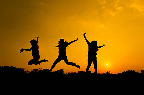 istock People are having fun in the garden on silhouette. 470426323