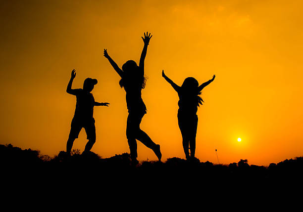 istock People are having fun in the garden on  silhouette. 470426363