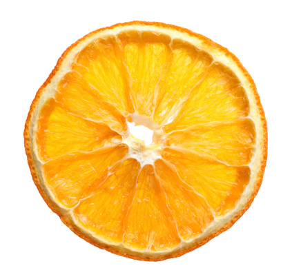 dried slice of orange over white background