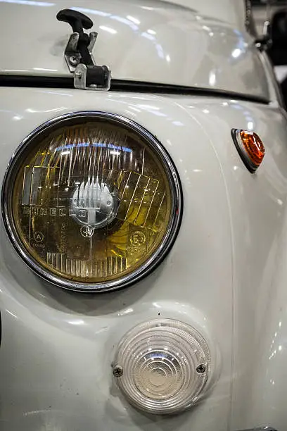 The headlight of an old Italian Car (Fiat 500 Abarth)