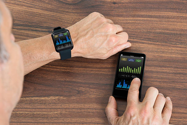 istock Man With Smartwatch And Cellphone Showing Heartbeat Rate 470428334